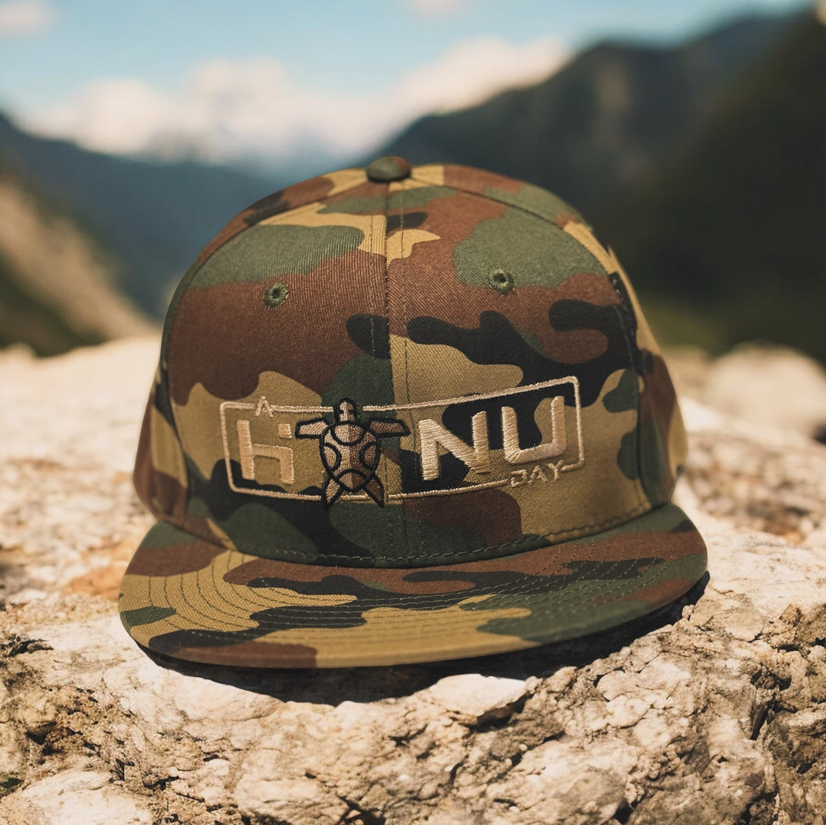 A Honu Day Signature Series Flat Brim Logo Hat — Camo Tan